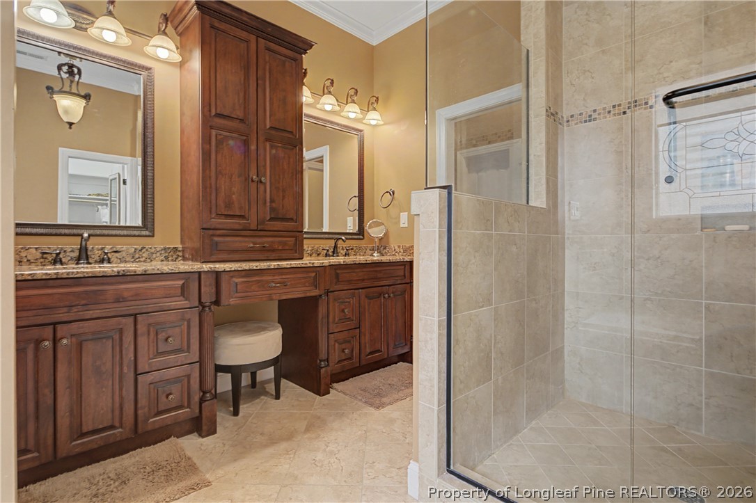 115 Micahs Way North Spring Lake, NC 28390 - Photo 24 of 39 a bathroom with a sink a toilet and shower