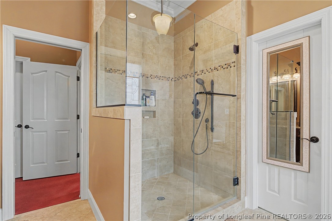 115 Micahs Way North Spring Lake, NC 28390 - Photo 25 of 39 a bathroom with a glass shower door