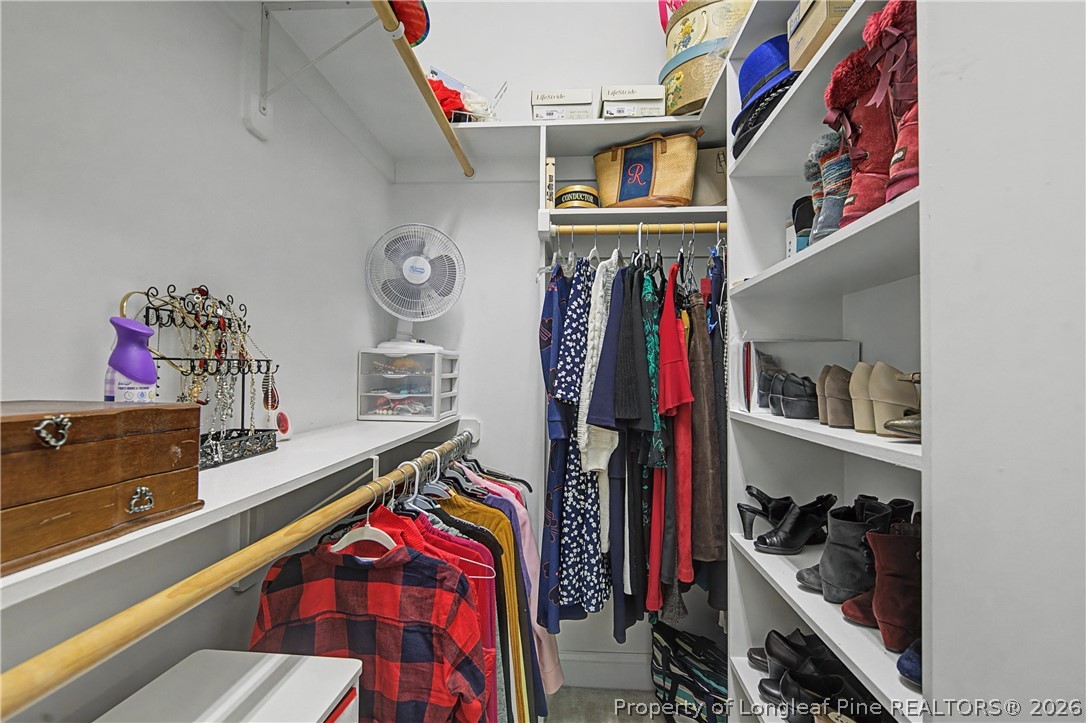 115 Micahs Way North Spring Lake, NC 28390 - Photo 27 of 39 a view of walk in closet with clothes and shoes