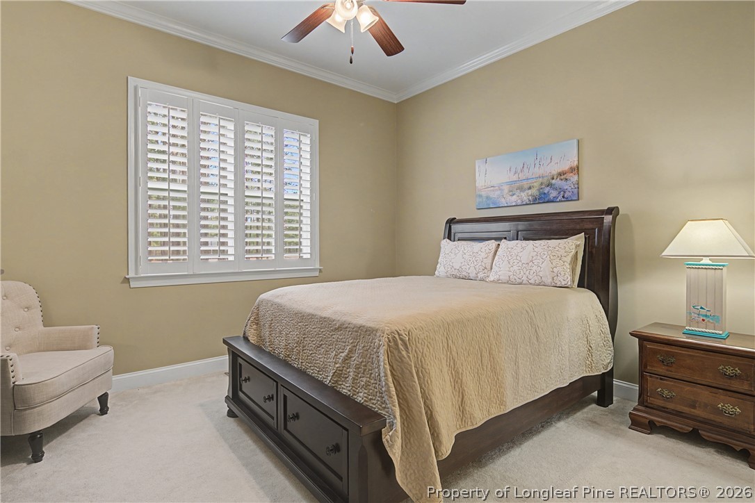 115 Micahs Way North Spring Lake, NC 28390 - Photo 29 of 39 a bedroom with a bed and a couch