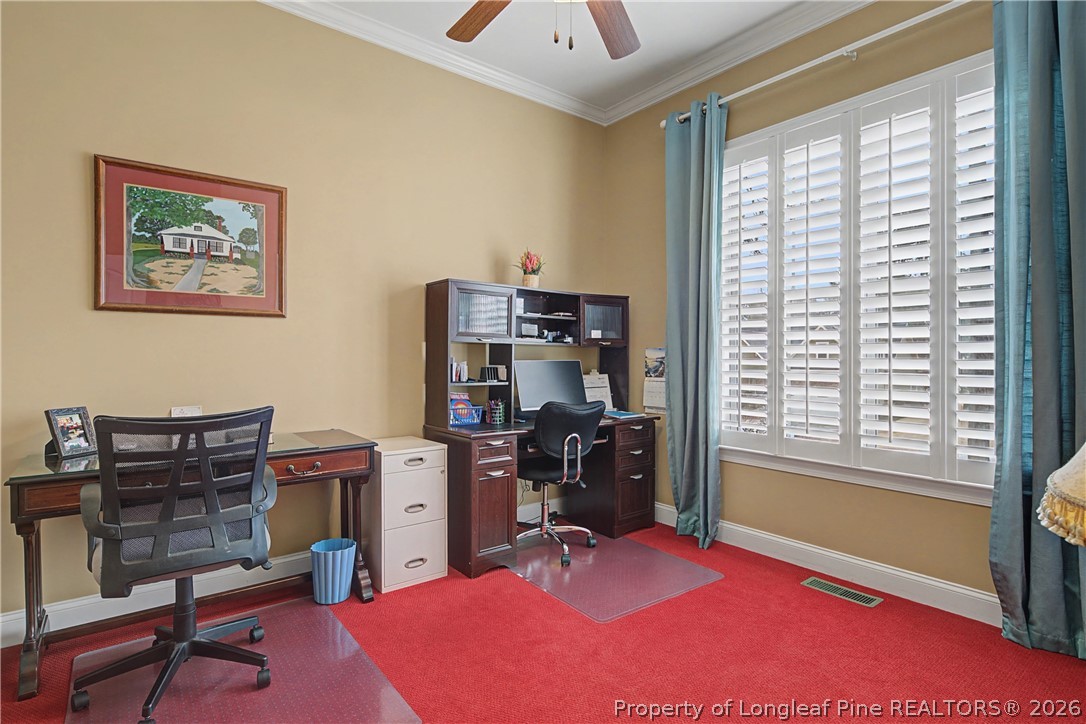115 Micahs Way North Spring Lake, NC 28390 - Photo 32 of 39 a view of a workspace with furniture and a window