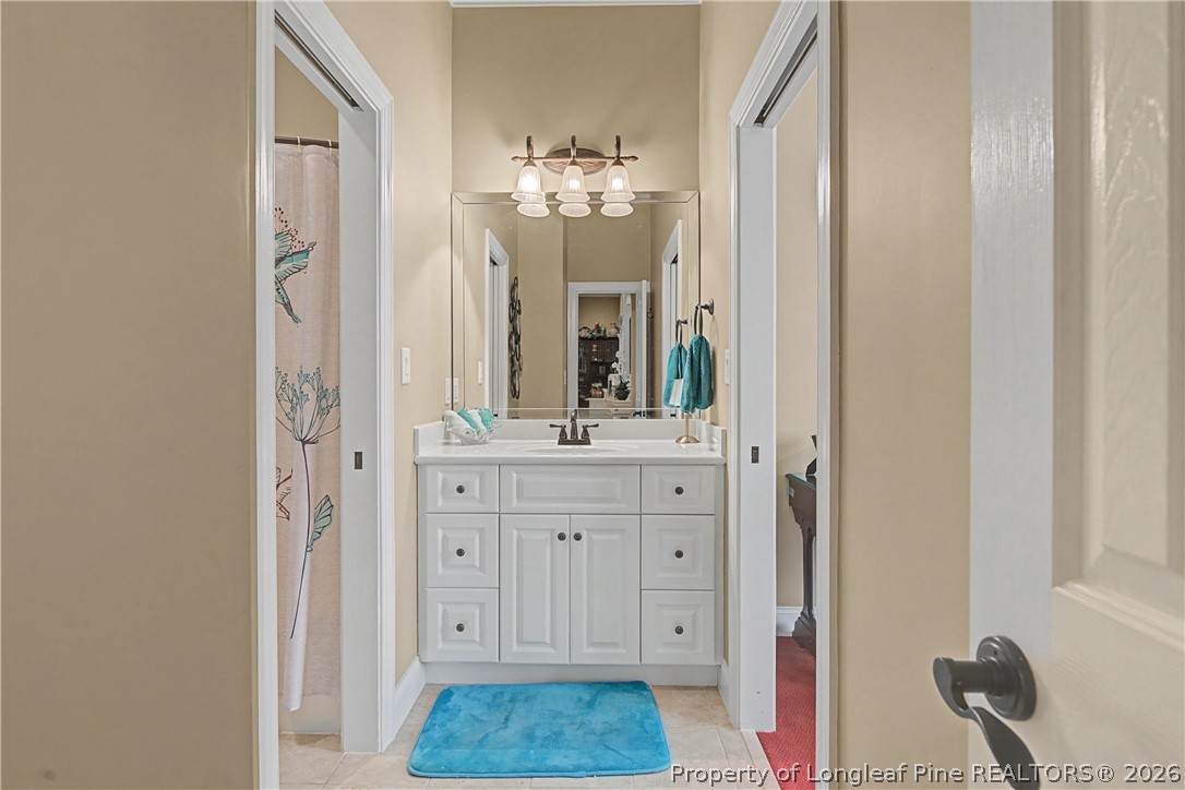 115 Micahs Way North Spring Lake, NC 28390 - Photo 34 of 39 a bathroom with a sink vanity and a mirror
