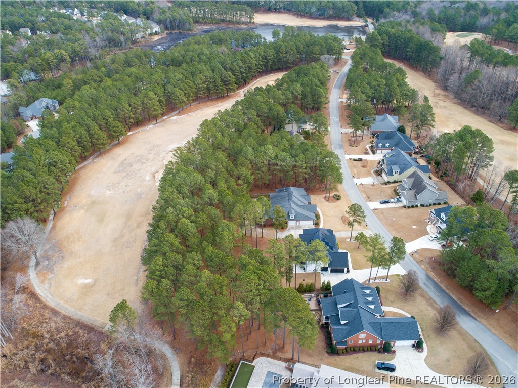 115 Micahs Way North Spring Lake, NC 28390 - Photo 39 of 39 an aerial view of a house with a yard and lake view
