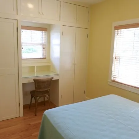 a bedroom with a bed and a table in it