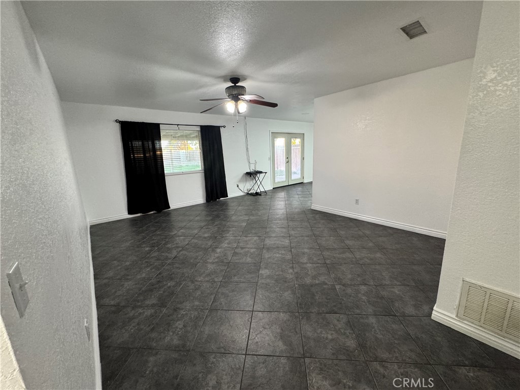 40471 Rome Beauty Way Cherry Valley, CA 92223 - Photo 13 of 32 wooden floor in an empty room with a window