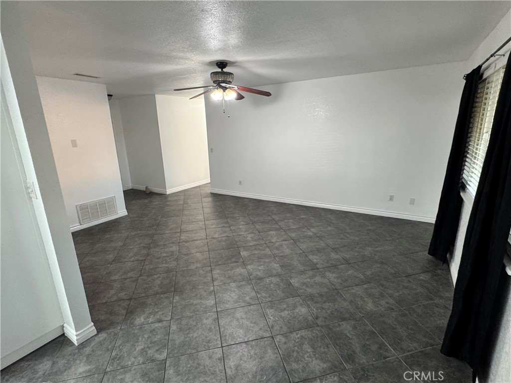 40471 Rome Beauty Way Cherry Valley, CA 92223 - Photo 14 of 32 wooden floor in an empty room with a bathroom
