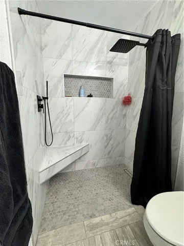 a bedroom with bed and window