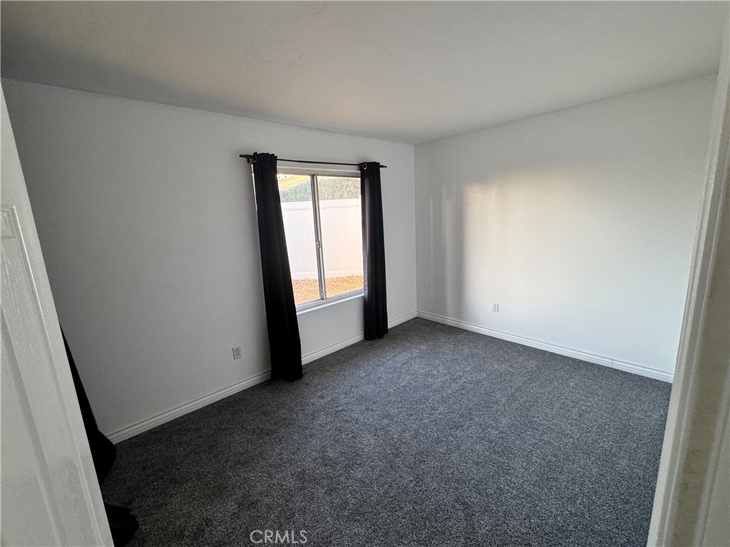 40471 Rome Beauty Way Cherry Valley, CA 92223 - Photo 18 of 32 an empty room with windows