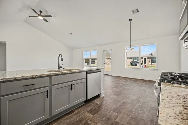 a kitchen with sink cabinets and window