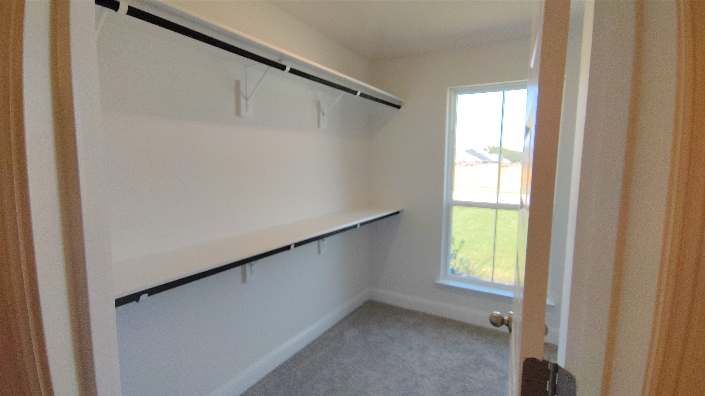 644 Greystone Lane Angleton, TX 77515 - Photo 13 of 21 a view of an empty room and a window