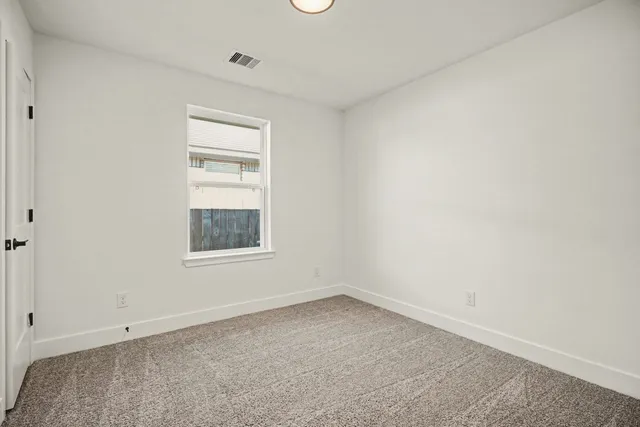 a room with a window and closet