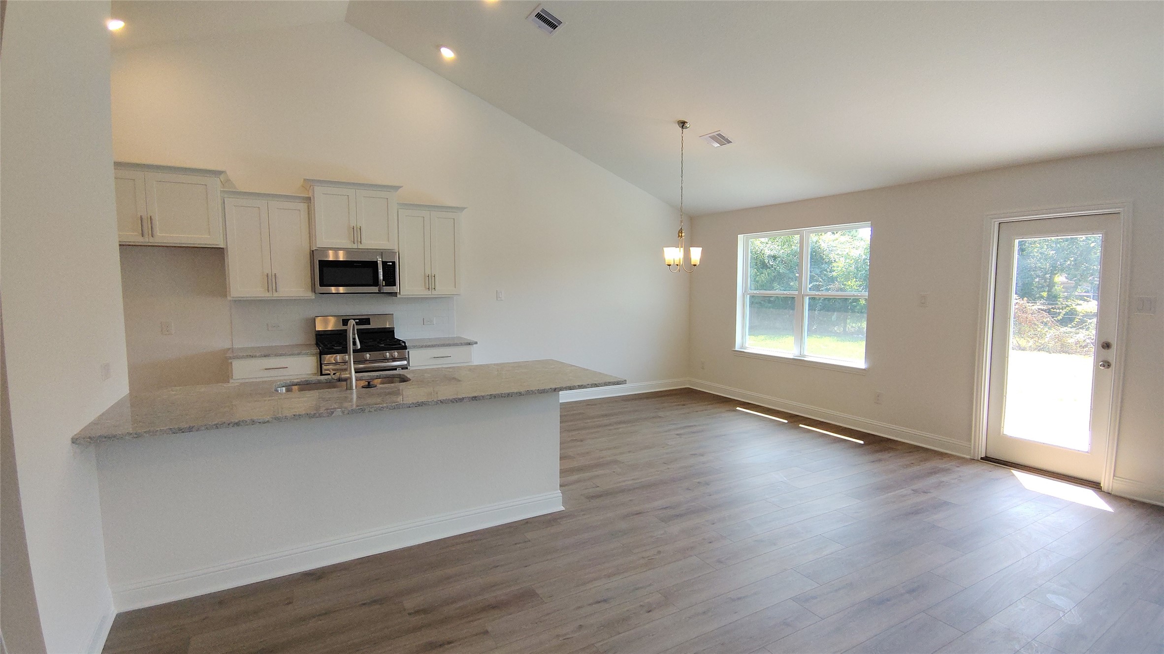644 Greystone Lane Angleton, TX 77515 - Photo 8 of 21 a view of kitchen and sink with wooden floor