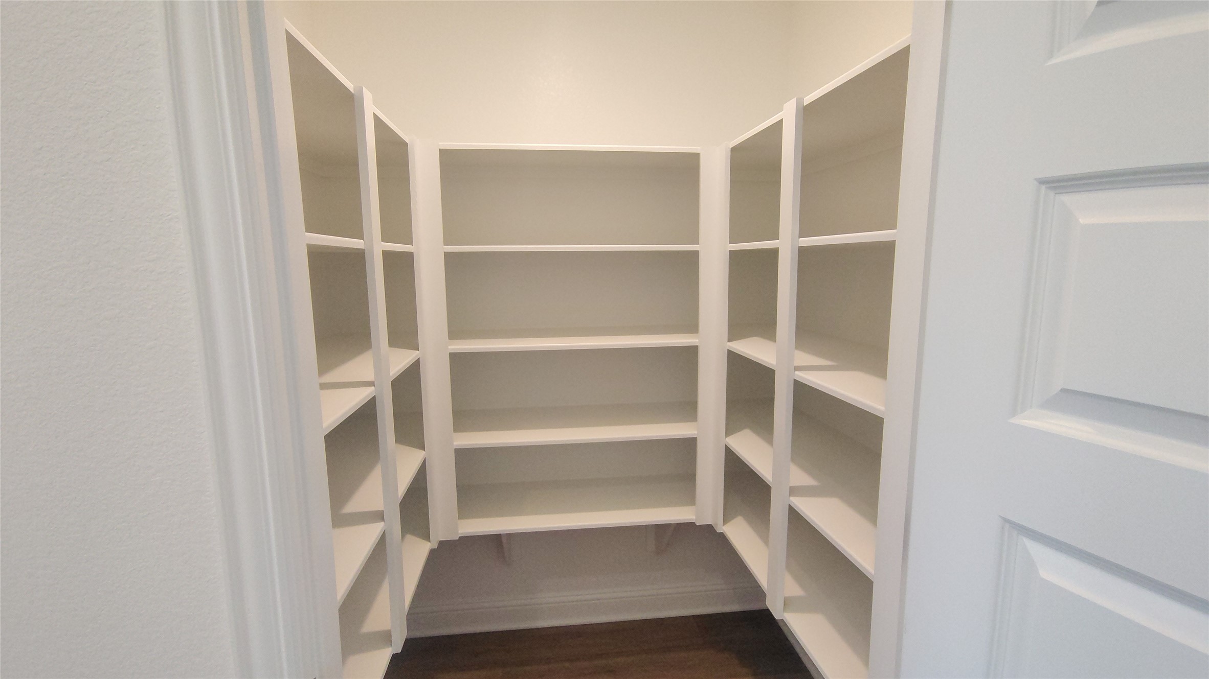 644 Greystone Lane Angleton, TX 77515 - Photo 9 of 21 a view of walk in closet with empty racks