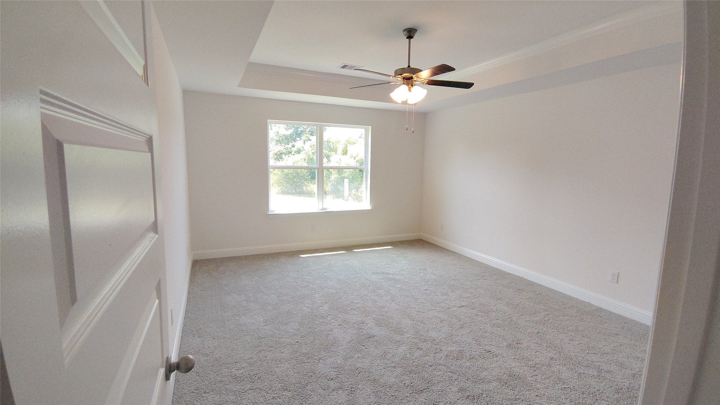 644 Greystone Lane Angleton, TX 77515 - Photo 10 of 21 an empty room with chandelier fan and windows