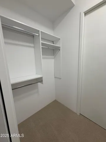 a view of an empty walk in closet