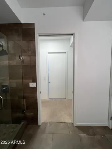 a view of a storage & utility room with washing machine