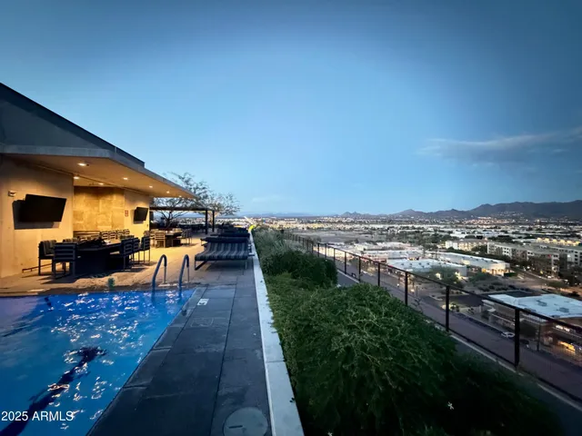a view of swimming pool and city view
