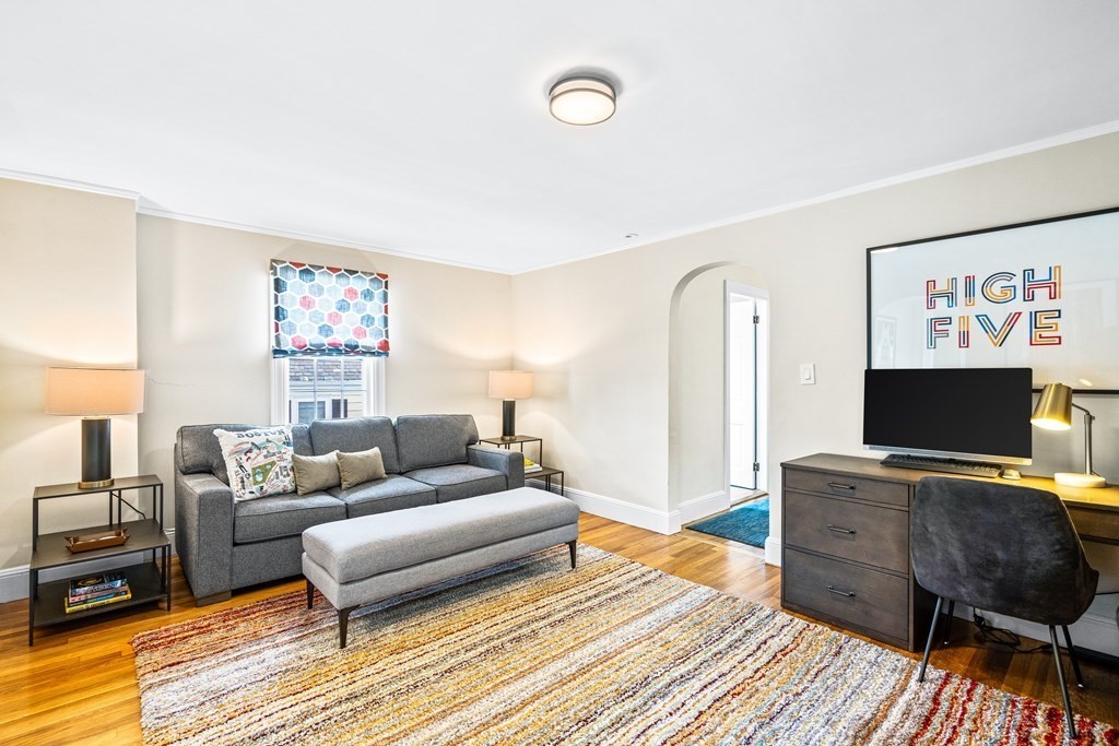 642 Centre Street Newton, MA 02458 - Photo 12 of 26 a living room with furniture and a flat screen tv