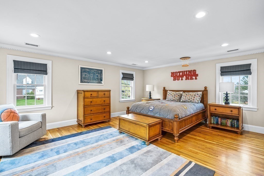 642 Centre Street Newton, MA 02458 - Photo 13 of 26 a bedroom with furniture and a wooden floor