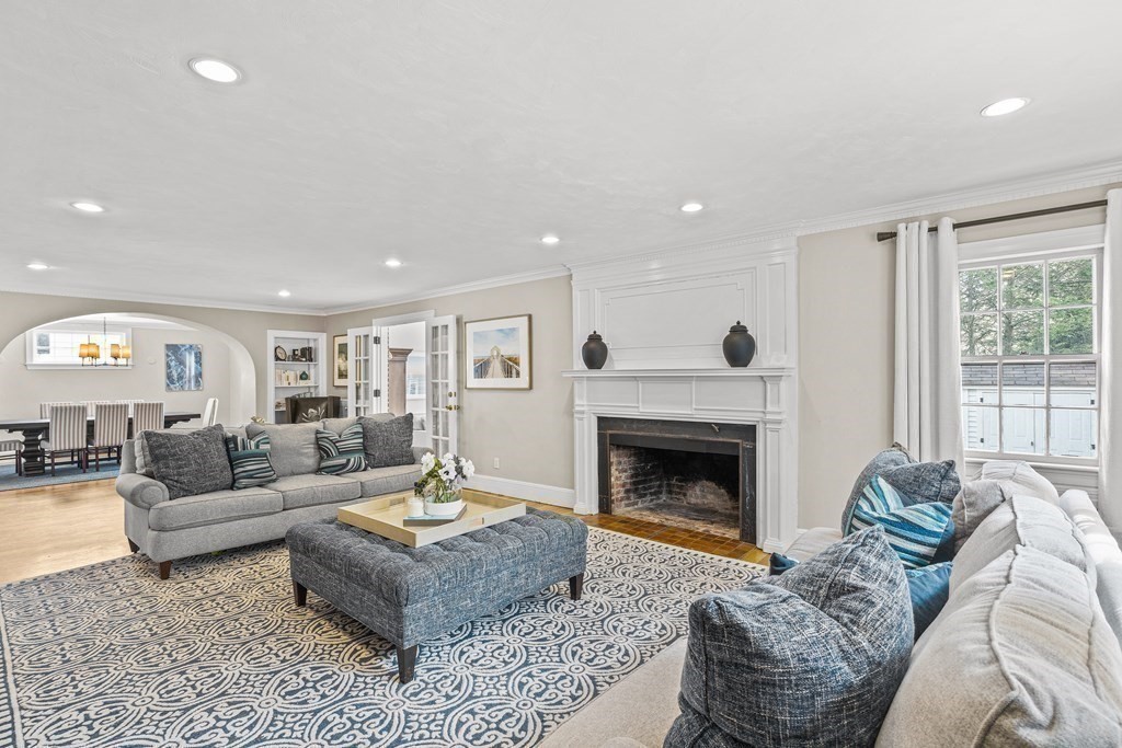 642 Centre Street Newton, MA 02458 - Photo 2 of 26 a living room with furniture and a fireplace