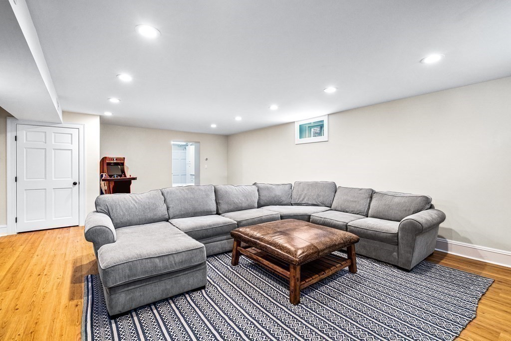 642 Centre Street Newton, MA 02458 - Photo 22 of 26 a living room with furniture a rug and a couch