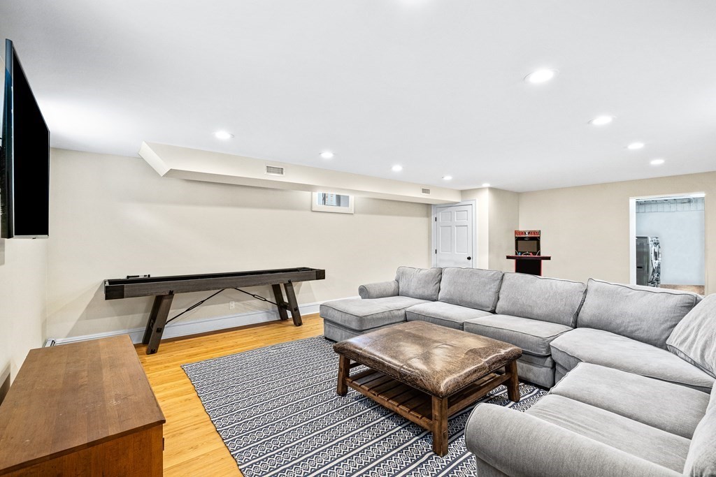 642 Centre Street Newton, MA 02458 - Photo 23 of 26 a living room with furniture and a rug