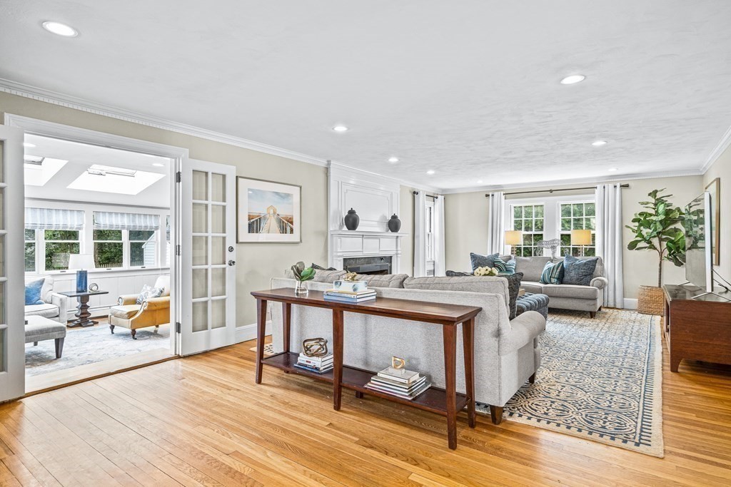 642 Centre Street Newton, MA 02458 - Photo 3 of 26 a living room with fireplace furniture and a table
