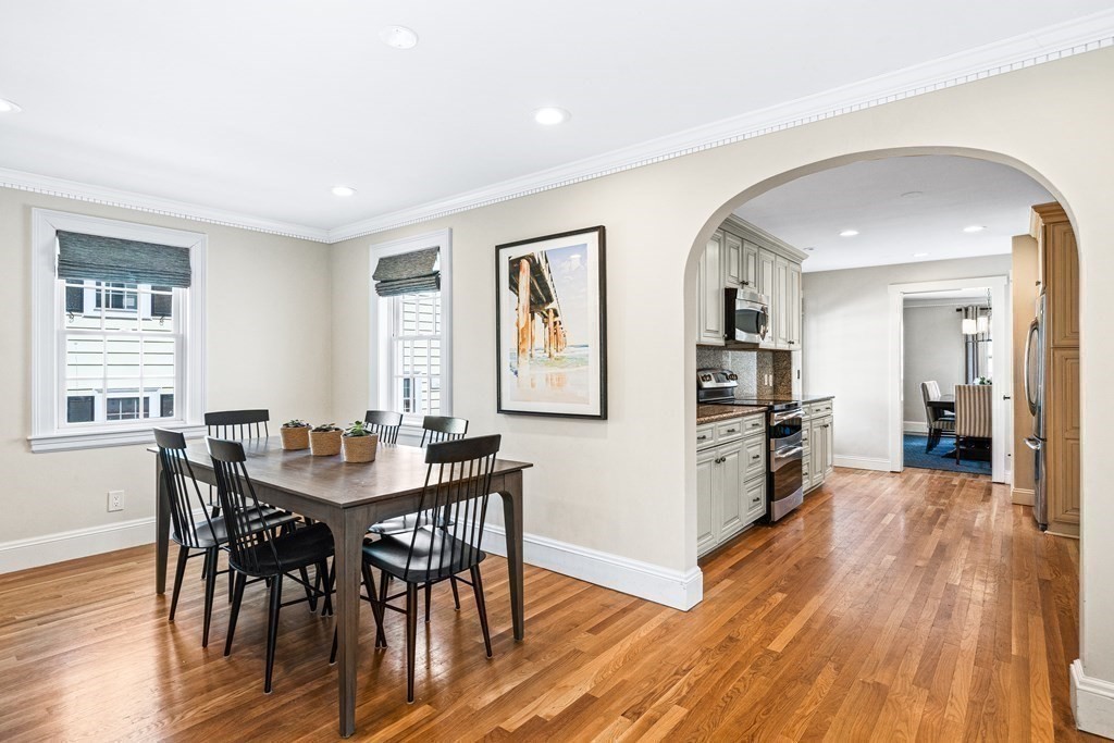 642 Centre Street Newton, MA 02458 - Photo 9 of 26 a view of a dining room with furniture and wooden floor