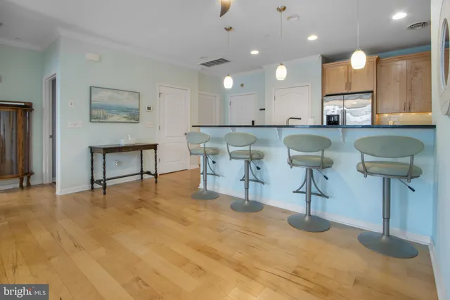 a view of kitchen with dining table and chairs