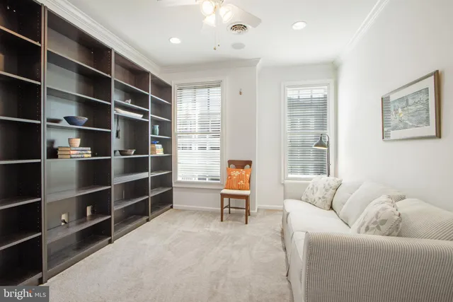 a living room with a couch and a window
