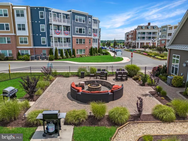 a view of a patio with couches and a table and chairs