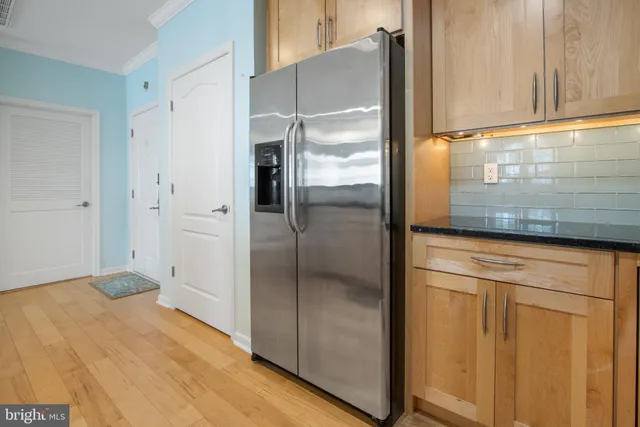 a bathroom with a shower and a glass door