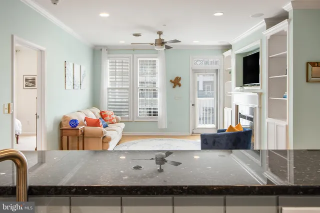 a living room with furniture and flat screen tv