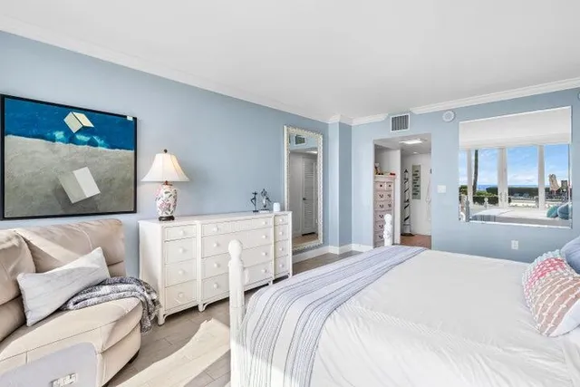 a bedroom with a bed and a couch