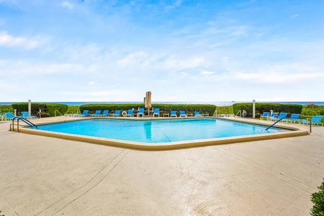 a view of swimming pool with a yard