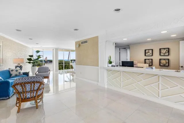 a view of kitchen with furniture and refrigerator