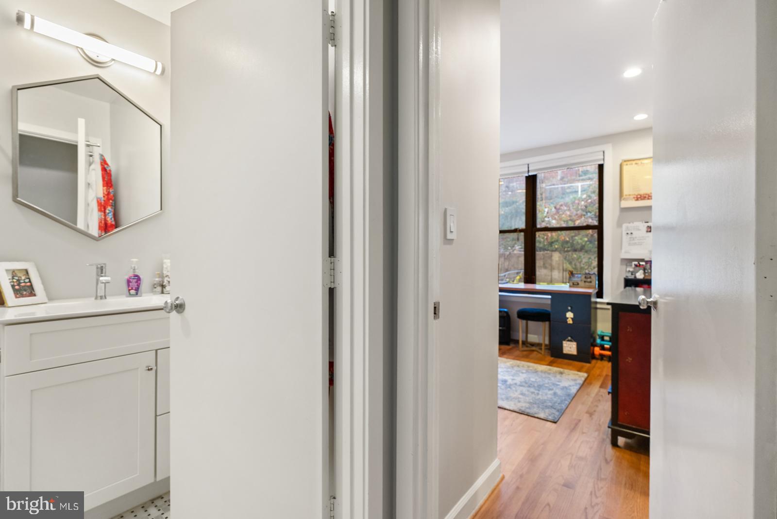1710 Summit Place Northwest, Unit 1710 Washington, DC 20009 - Photo 18 of 35 a bathroom with a sink and a mirror