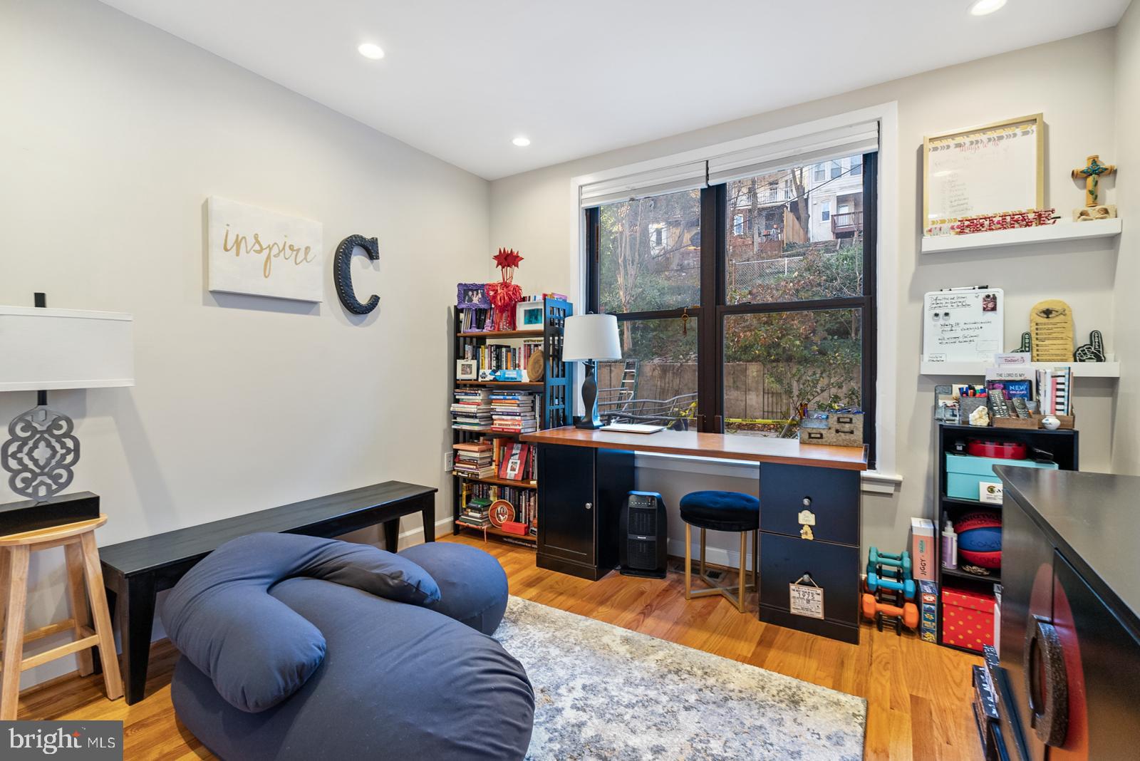 1710 Summit Place Northwest, Unit 1710 Washington, DC 20009 - Photo 21 of 35 a room with furniture toys and a large window