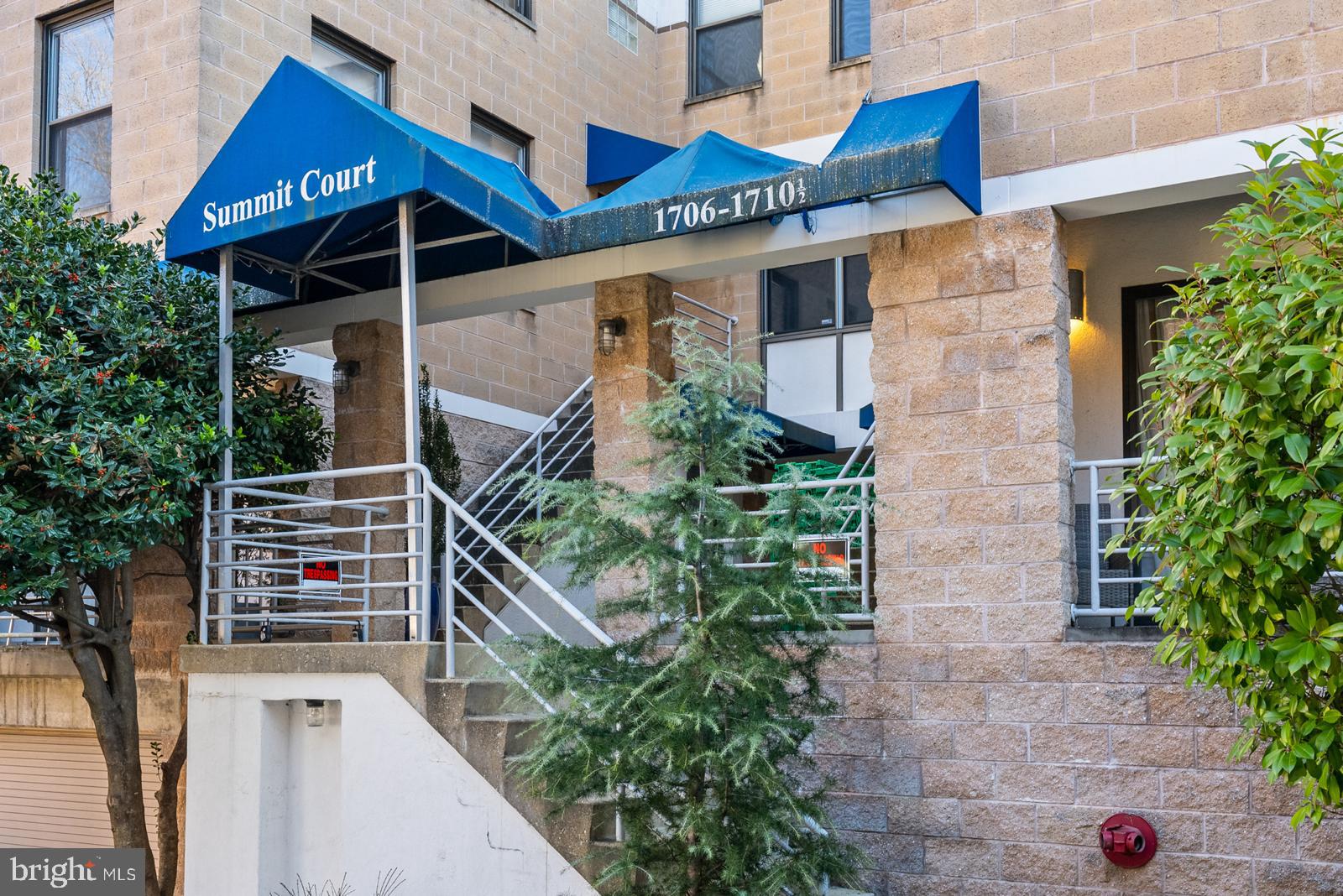 1710 Summit Place Northwest, Unit 1710 Washington, DC 20009 - Photo 27 of 35 a front view of a house with a yard