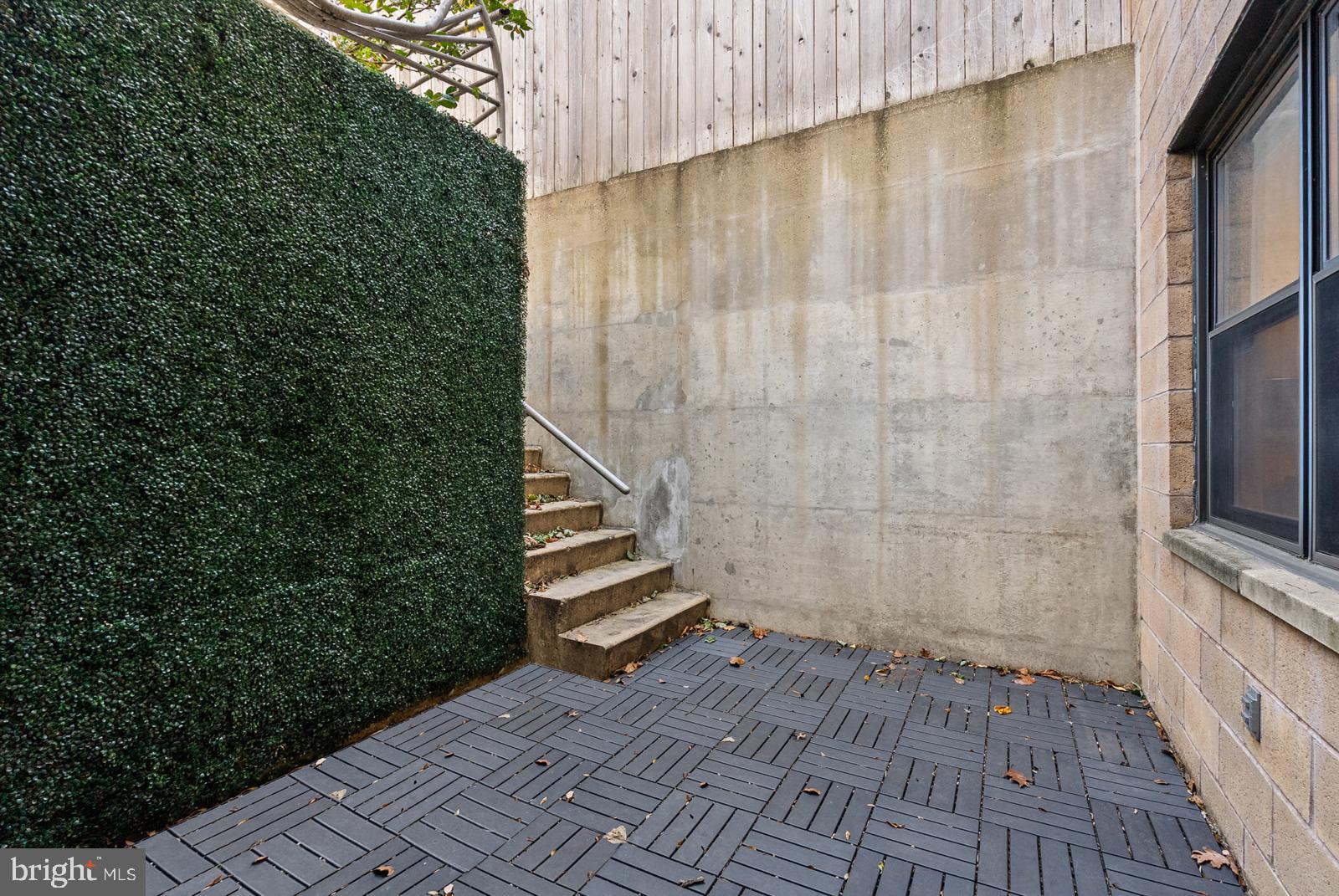 1710 Summit Place Northwest, Unit 1710 Washington, DC 20009 - Photo 31 of 35 a view of a small space with wooden deck and shower