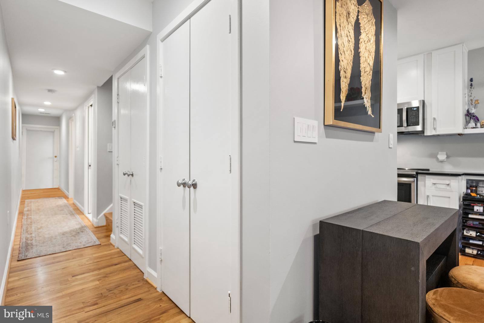 1710 Summit Place Northwest, Unit 1710 Washington, DC 20009 - Photo 7 of 35 a view of a kitchen from the hallway