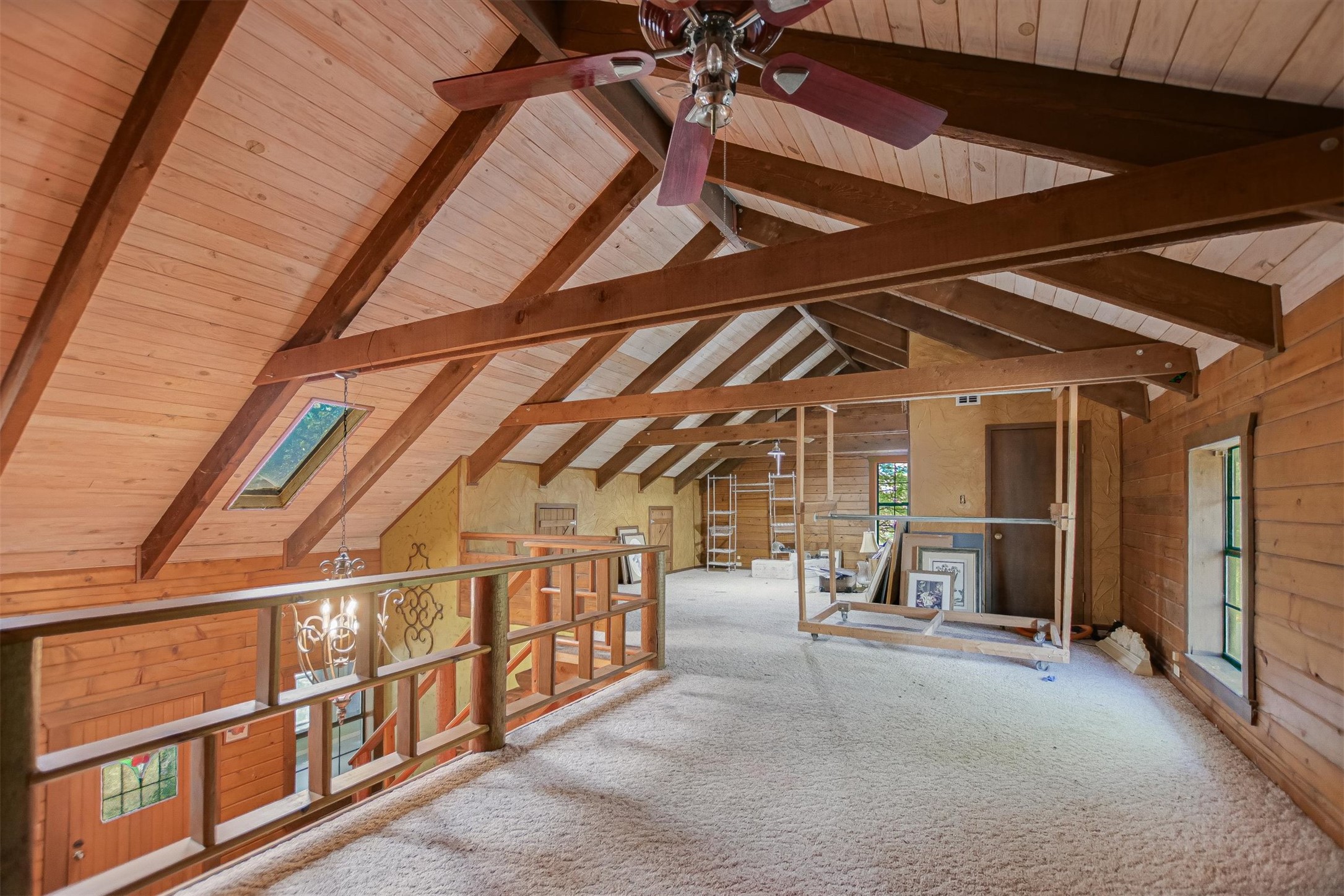 12711 Rr, Unit 12 Wimberley, TX 78676 - Photo 10 of 20 The upstairs loft guest bedroom overlooks the living area, providing a private space for visitors