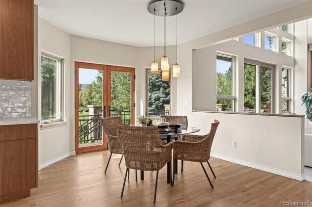 a kitchen with a large window sink and cabinets