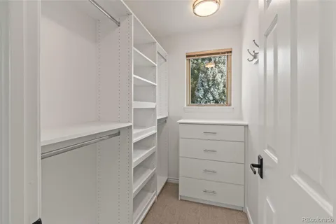 a spacious bathroom with a granite countertop tub sink and mirror