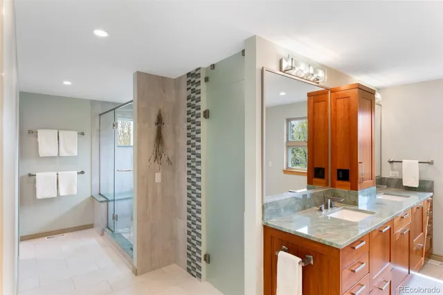 a bathroom with a glass shower door