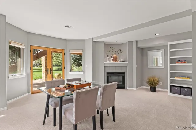a view of a porch with plants and backyard