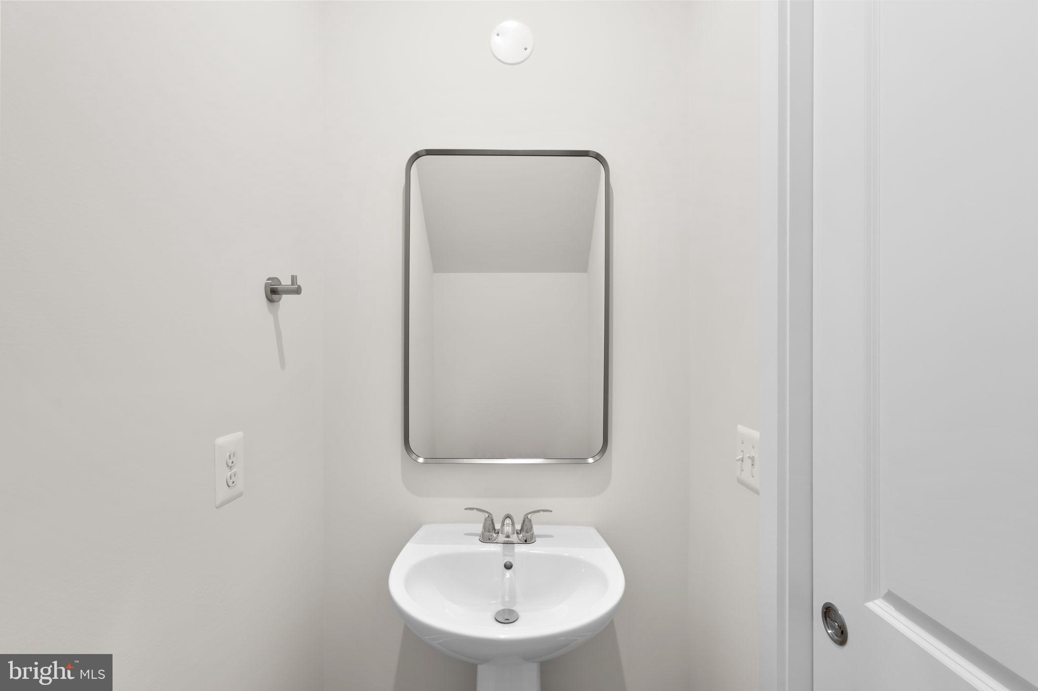 108 Keystone Winchester, VA 22603 - Photo 25 of 46 a bathroom with a sink and a mirror
