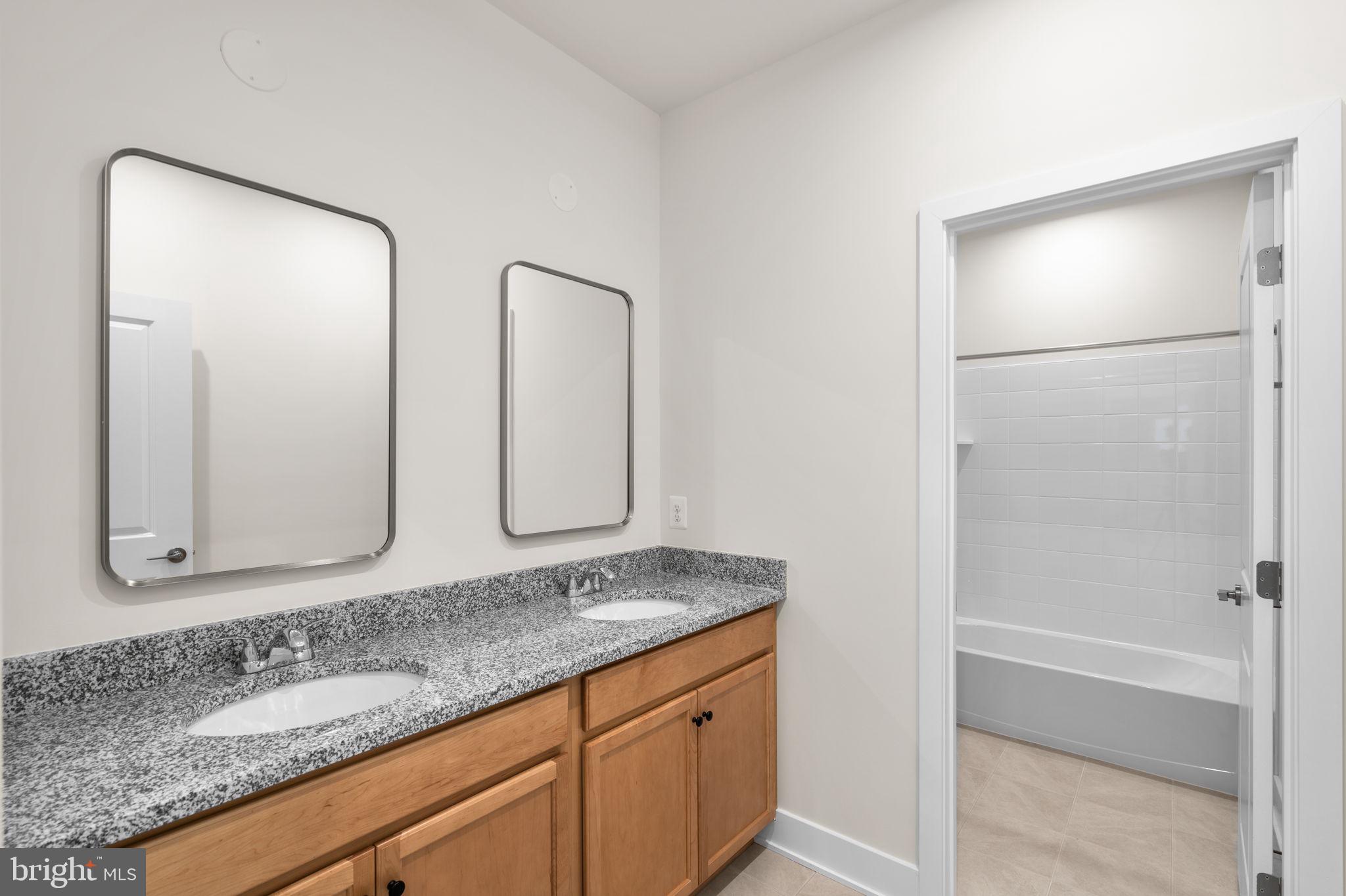 108 Keystone Winchester, VA 22603 - Photo 34 of 46 a bathroom with 2 sink and a mirror