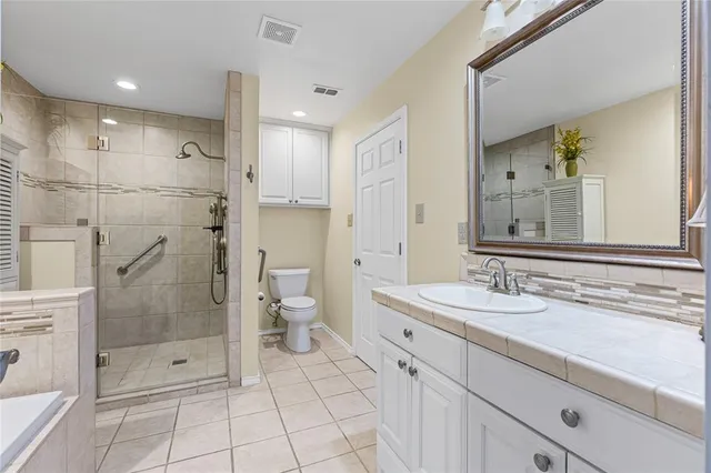 a bathroom with a shower sink and mirror