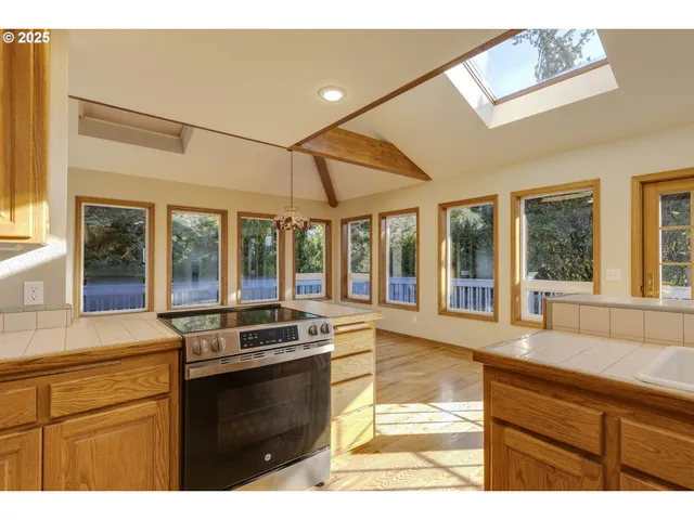 a kitchen with a stove and a sink